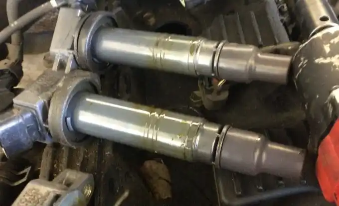 Worn oil-fouled spark plugs from a Toyota Tacoma at Beacon Auto Care San Mateo